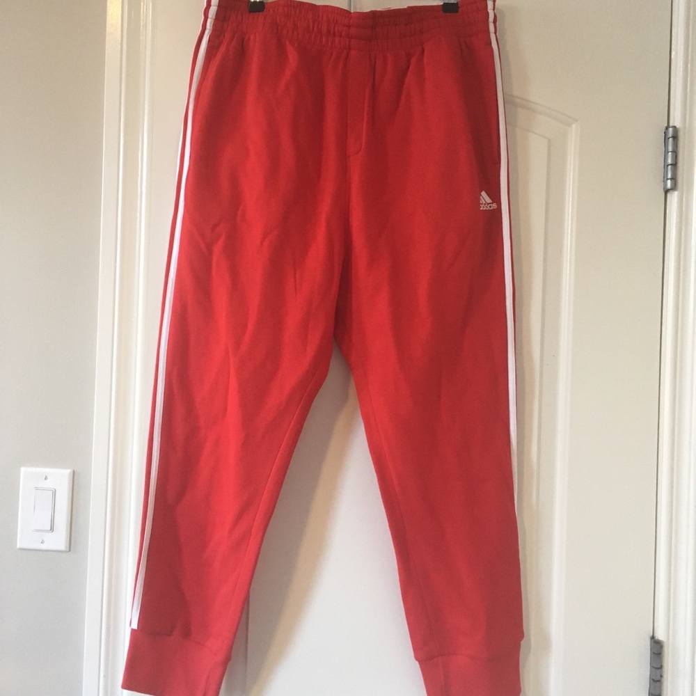 Red Adidas sweatpants